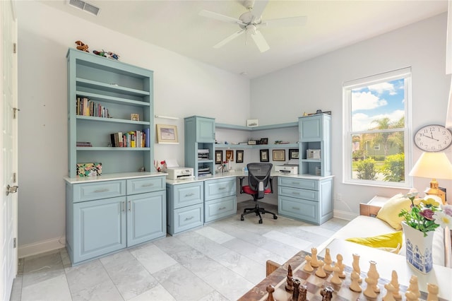 2816 E Venetian Lake Cir, New Smyrna Beach, FL 32168 - office space featuring ceiling fan, built in study area, and light marble finish flooring