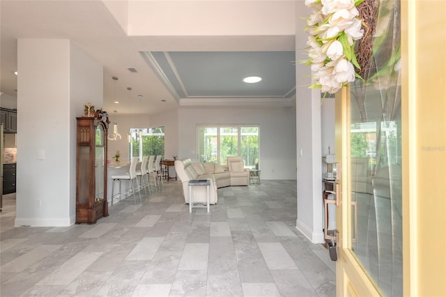 2816 E Venetian Lake Cir, New Smyrna Beach, FL 32168 - foyer entrance featuring a tray ceiling, recessed lighting, and ornamental molding