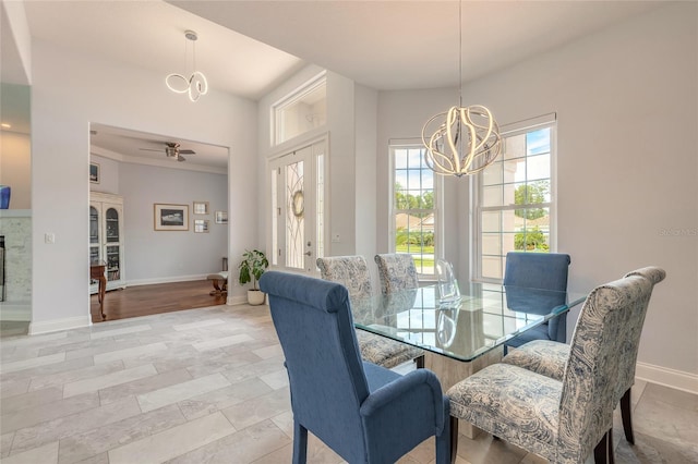 2816 E Venetian Lake Cir, New Smyrna Beach, FL 32168 - dining area with a chandelier and ceiling fan