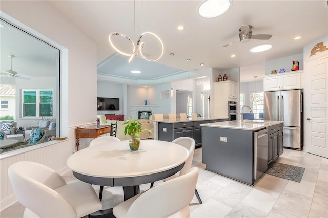 2816 E Venetian Lake Cir, New Smyrna Beach, FL 32168 - dining room with a ceiling fan, healthy amount of natural light, a fireplace, and recessed lighting