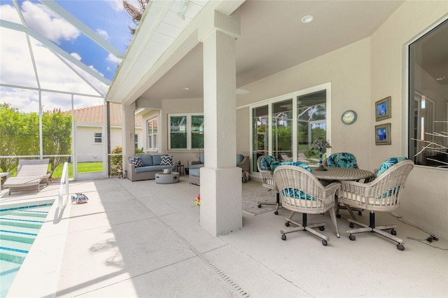 2816 E Venetian Lake Cir, New Smyrna Beach, FL 32168 - view of patio with an outdoor living space and glass enclosure