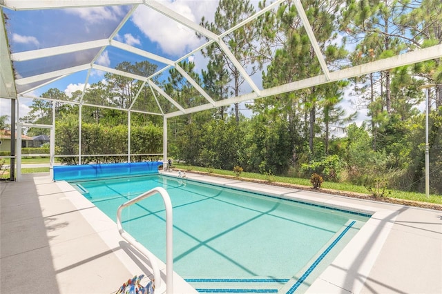 2816 E Venetian Lake Cir, New Smyrna Beach, FL 32168 - swimming pool with a patio area, view of scattered trees, and a lanai