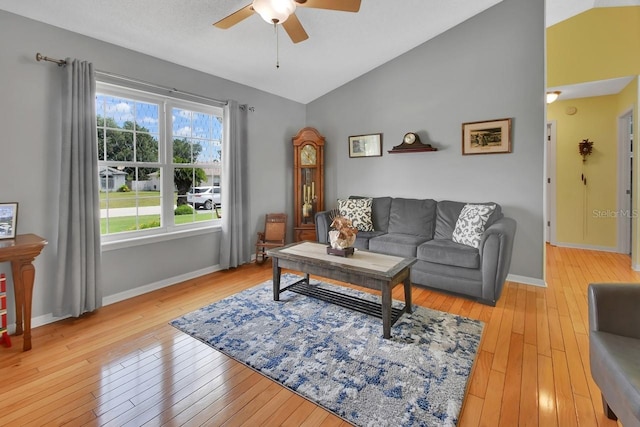1366 Valhalla St, Deltona, FL 32725 - living area featuring a ceiling fan, light wood-style floors, and high vaulted ceiling