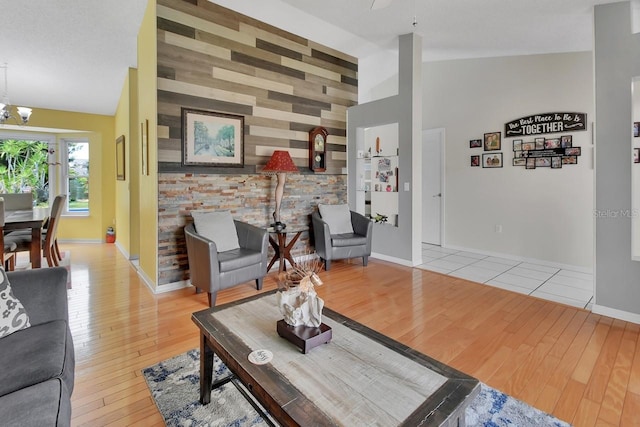 1366 Valhalla St, Deltona, FL 32725 - living area with wood finished floors, vaulted ceiling, and a chandelier