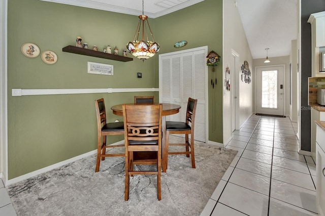1366 Valhalla St, Deltona, FL 32725 - dining room with tile patterned floors, a chandelier, and vaulted ceiling