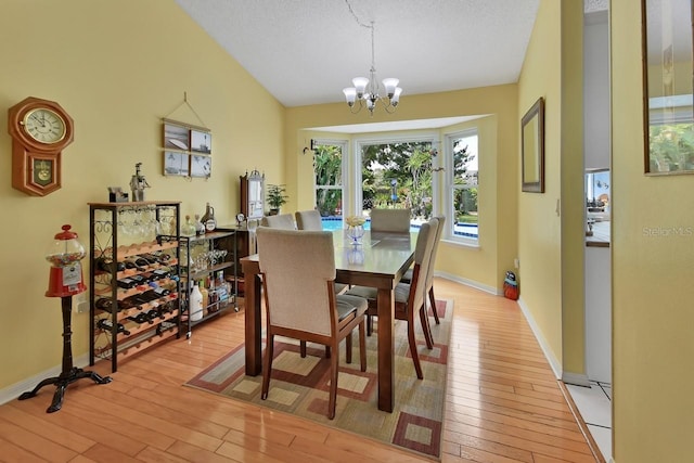 1366 Valhalla St, Deltona, FL 32725 - dining area with a chandelier and light wood-type flooring