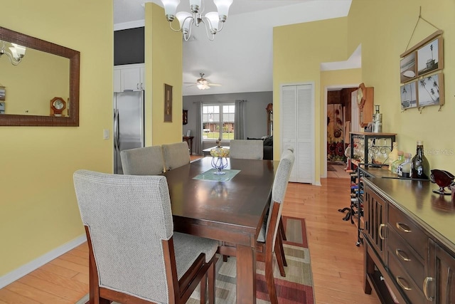 1366 Valhalla St, Deltona, FL 32725 - dining room featuring light wood-style floors, ceiling fan, and a chandelier