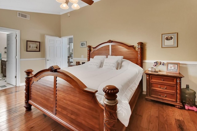 1366 Valhalla St, Deltona, FL 32725 - bedroom featuring dark wood-style floors, crown molding, ensuite bath, and ceiling fan