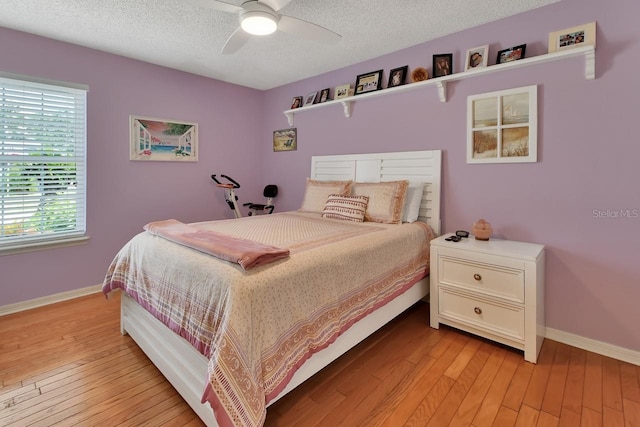 1366 Valhalla St, Deltona, FL 32725 - bedroom with light wood-style floors, a textured ceiling, and a ceiling fan
