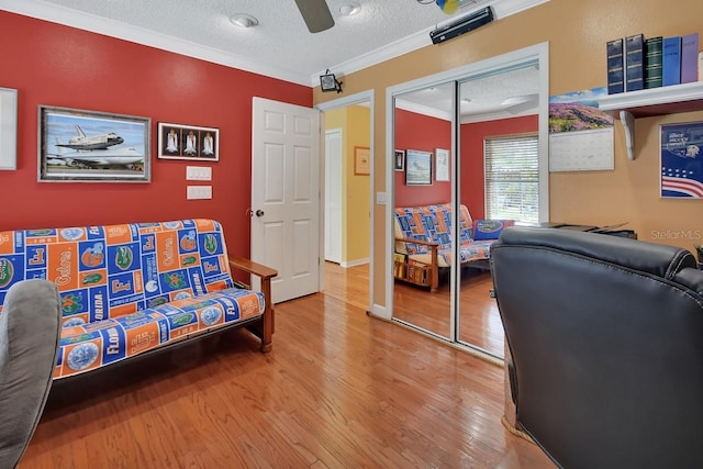 1366 Valhalla St, Deltona, FL 32725 - living area with a textured ceiling, ornamental molding, wood finished floors, and ceiling fan