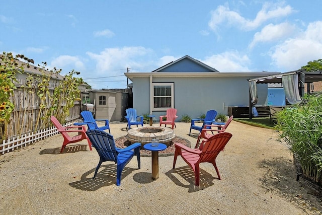 1366 Valhalla St, Deltona, FL 32725 - back of house with an outdoor fire pit and stucco siding