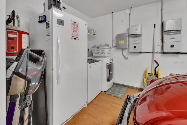 1366 Valhalla St, Deltona, FL 32725 - laundry area with independent washer and dryer and light wood finished floors