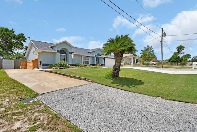 1366 Valhalla St, Deltona, FL 32725 - ranch-style house with stucco siding, concrete driveway, and a gate