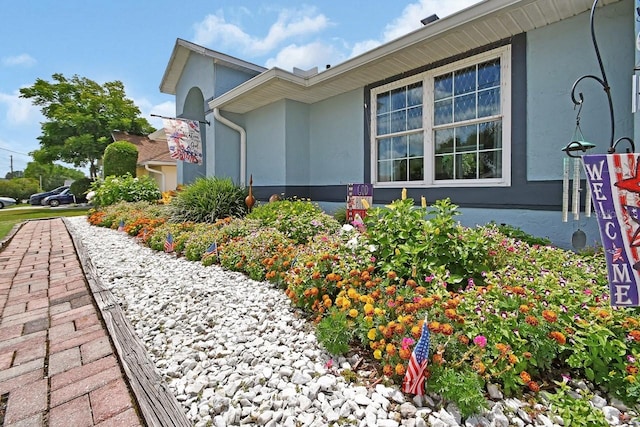 1366 Valhalla St, Deltona, FL 32725 - view of property exterior with stucco siding
