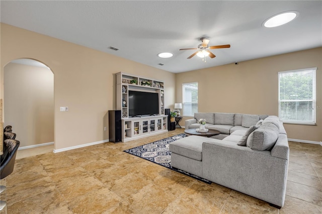 710 Grape Ivy Ln, New Smyrna Beach, FL 32168 - living room with ceiling fan, arched walkways, and healthy amount of natural light