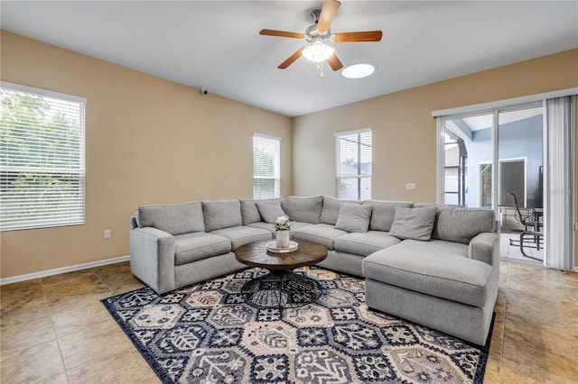 710 Grape Ivy Ln, New Smyrna Beach, FL 32168 - living area featuring ceiling fan and baseboards