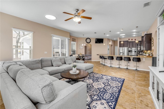 710 Grape Ivy Ln, New Smyrna Beach, FL 32168 - living area with a ceiling fan and light tile patterned floors