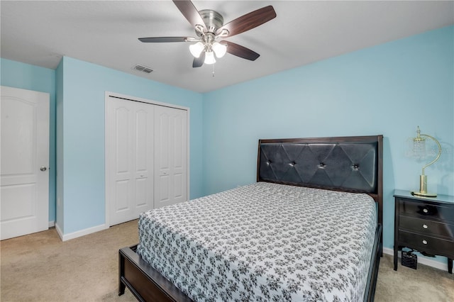 710 Grape Ivy Ln, New Smyrna Beach, FL 32168 - bedroom featuring light colored carpet, a closet, and a ceiling fan