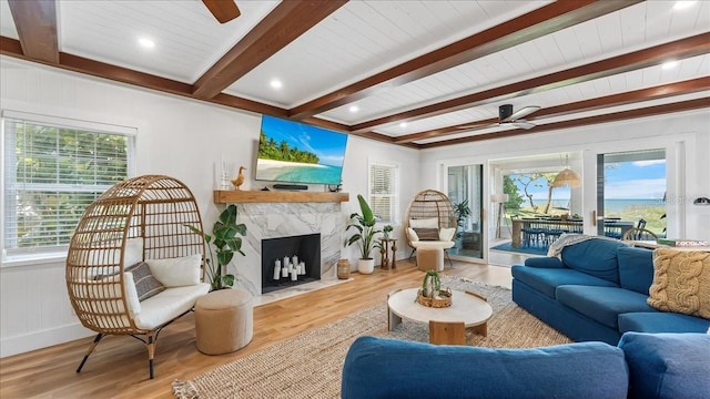943 S Atlantic Ave, Cocoa Beach, FL 32931 - living area featuring a ceiling fan, plenty of natural light, wood finished floors, and beam ceiling