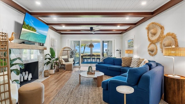943 S Atlantic Ave, Cocoa Beach, FL 32931 - living room with wood finished floors, beam ceiling, and ceiling fan