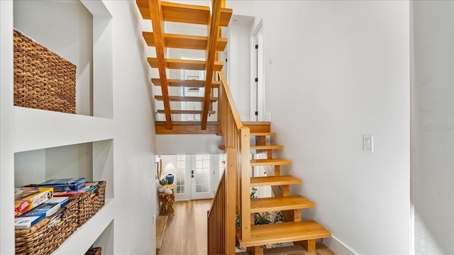 943 S Atlantic Ave, Cocoa Beach, FL 32931 - staircase with wood finished floors