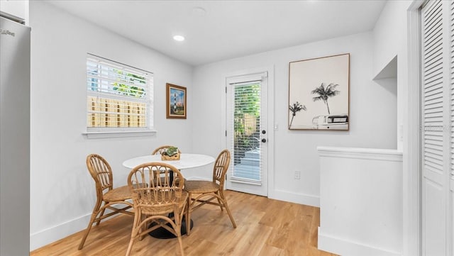 943 S Atlantic Ave, Cocoa Beach, FL 32931 - dining room with light wood-style flooring and recessed lighting