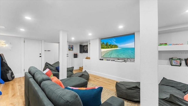 943 S Atlantic Ave, Cocoa Beach, FL 32931 - living room featuring wood finished floors and recessed lighting