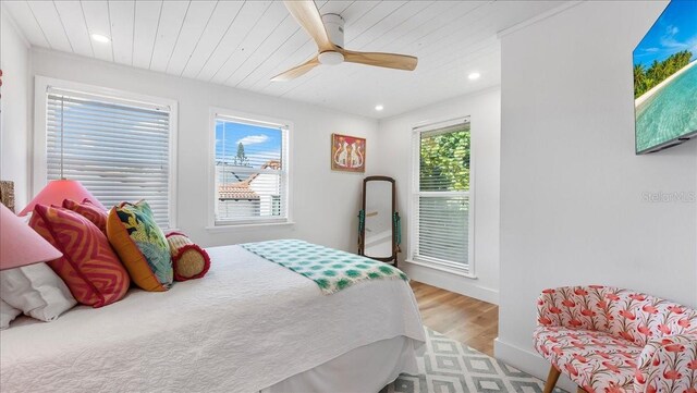 943 S Atlantic Ave, Cocoa Beach, FL 32931 - bedroom with light wood-style floors, recessed lighting, ceiling fan, and wood ceiling