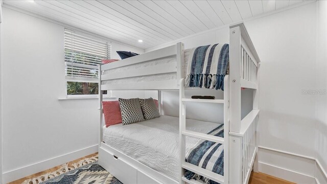 943 S Atlantic Ave, Cocoa Beach, FL 32931 - bedroom featuring wood ceiling and wood finished floors