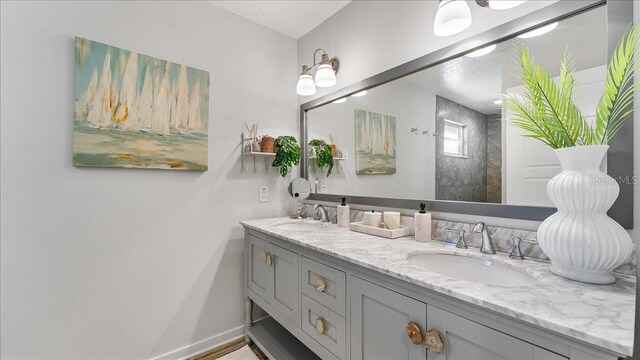 943 S Atlantic Ave, Cocoa Beach, FL 32931 - full bath featuring double vanity and baseboards
