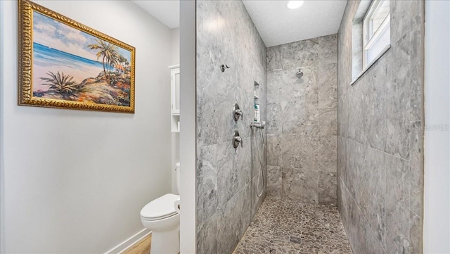 943 S Atlantic Ave, Cocoa Beach, FL 32931 - full bathroom with tiled shower and toilet