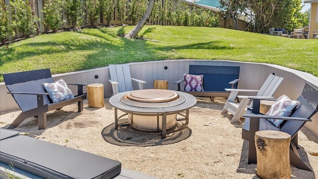 943 S Atlantic Ave, Cocoa Beach, FL 32931 - view of patio with an outdoor fire pit
