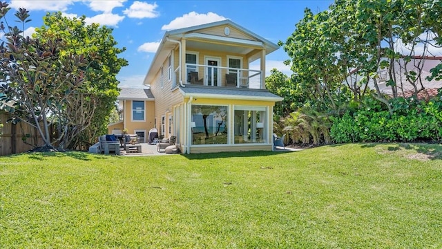 943 S Atlantic Ave, Cocoa Beach, FL 32931 - back of property with a balcony and a patio