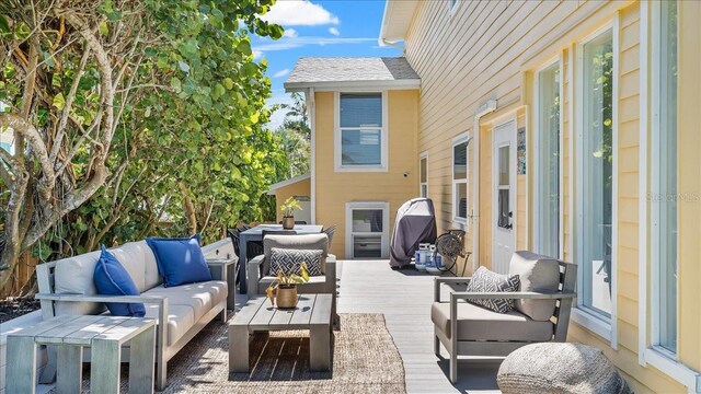 943 S Atlantic Ave, Cocoa Beach, FL 32931 - view of patio / terrace featuring an outdoor living space and a wooden deck