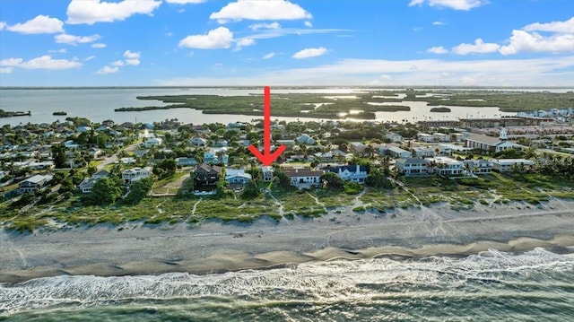 943 S Atlantic Ave, Cocoa Beach, FL 32931 - aerial view of property and surrounding area with a large body of water and nearby suburban area