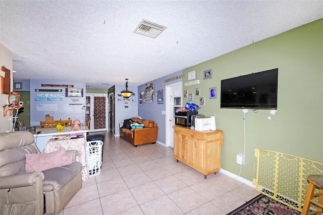 4831 Cypress Tree Dr, Tampa, FL 33624 - living room with a textured ceiling and light tile patterned floors