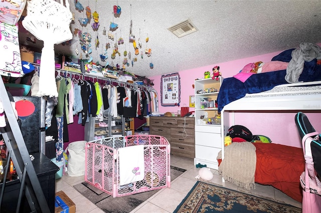 4831 Cypress Tree Dr, Tampa, FL 33624 - walk in closet featuring tile patterned floors