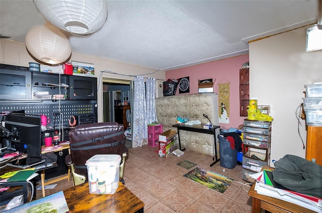 4831 Cypress Tree Dr, Tampa, FL 33624 - kitchen with tile patterned flooring and a textured ceiling