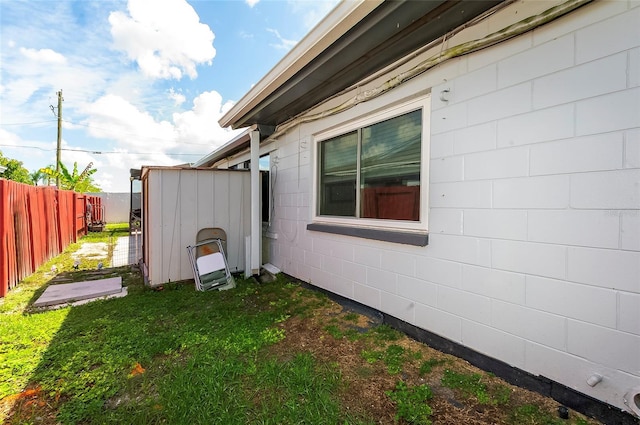 4831 Cypress Tree Dr, Tampa, FL 33624 - view of side of property with concrete block siding and a shed