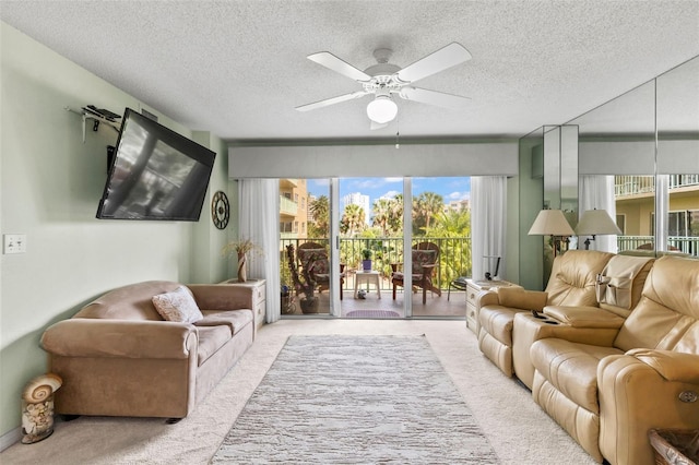 4 Oceans W Blvd Unit 308C, Daytona Beach, FL 32118 - carpeted living room featuring ceiling fan and a textured ceiling