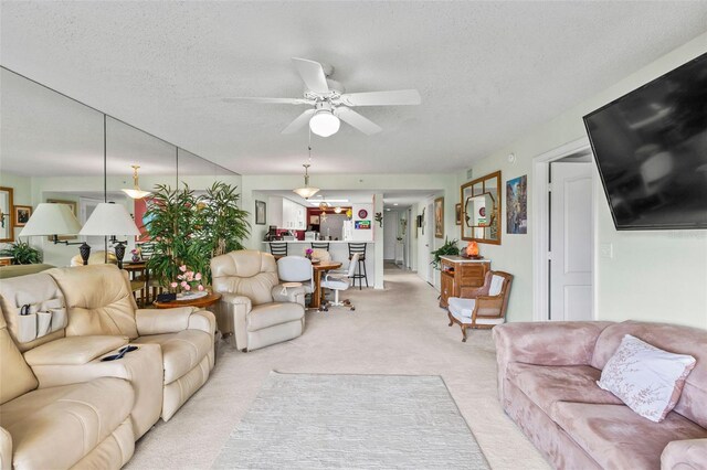 4 Oceans W Blvd Unit 308C, Daytona Beach, FL 32118 - living room with ceiling fan, light colored carpet, and a textured ceiling