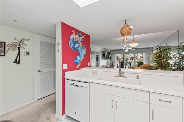 4 Oceans W Blvd Unit 308C, Daytona Beach, FL 32118 - kitchen with dishwasher, light countertops, light colored carpet, and white cabinets
