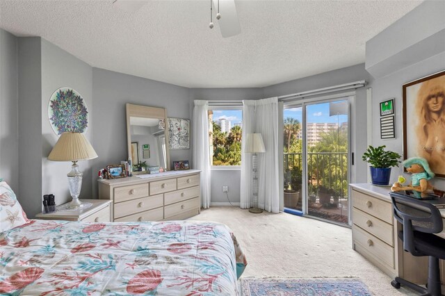 4 Oceans W Blvd Unit 308C, Daytona Beach, FL 32118 - bedroom with access to outside, light carpet, and a textured ceiling