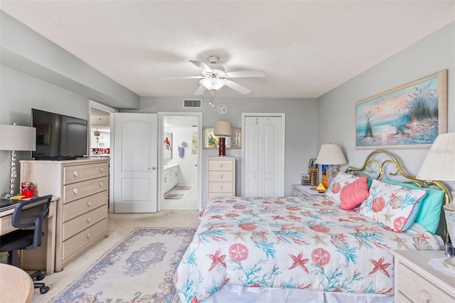 4 Oceans W Blvd Unit 308C, Daytona Beach, FL 32118 - bedroom with light colored carpet, a closet, a textured ceiling, ensuite bathroom, and a ceiling fan