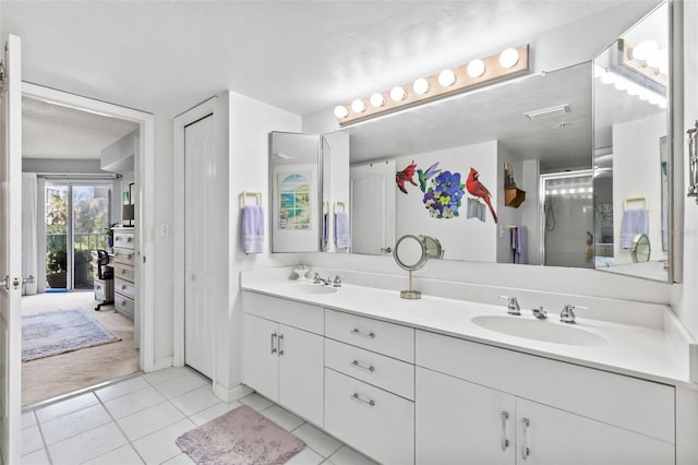 4 Oceans W Blvd Unit 308C, Daytona Beach, FL 32118 - full bath featuring double vanity, tile patterned flooring, and a stall shower