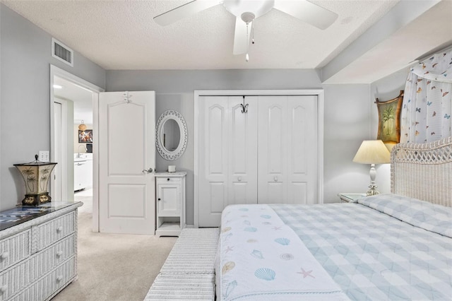 4 Oceans W Blvd Unit 308C, Daytona Beach, FL 32118 - bedroom featuring light carpet, a closet, ceiling fan, and a textured ceiling