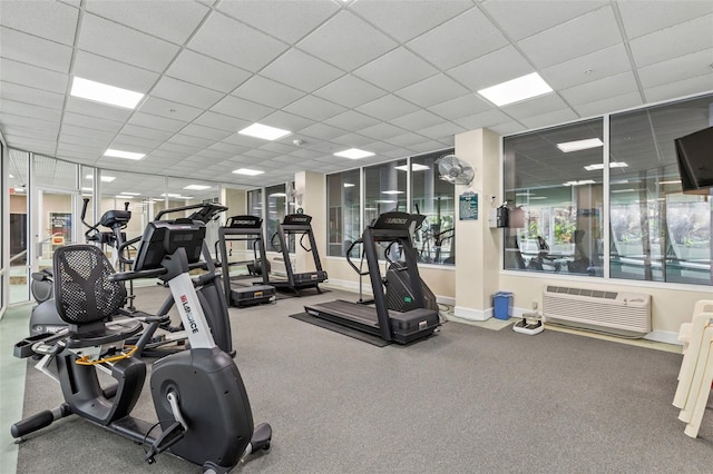 4 Oceans W Blvd Unit 308C, Daytona Beach, FL 32118 - exercise room with a wall mounted air conditioner and a drop ceiling