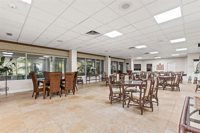 4 Oceans W Blvd Unit 308C, Daytona Beach, FL 32118 - dining room with a paneled ceiling and baseboards