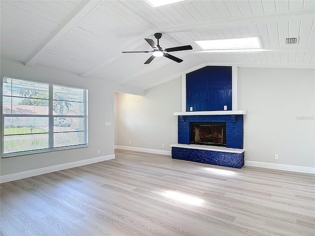 1019 Chippewa Trl, Daytona Beach, FL 32117 - unfurnished living room featuring wood finished floors, a brick fireplace, and a ceiling fan