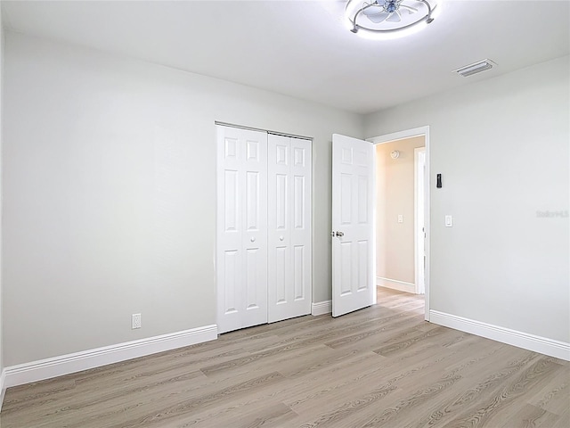 1019 Chippewa Trl, Daytona Beach, FL 32117 - unfurnished bedroom featuring light wood-style floors and a closet